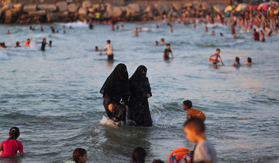 Palestinians enjoy the beach in Gaza City
